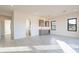 Bright living room with modern cabinets, wine cooler, and beautiful wood-look tile flooring at 25564 N 119Th St, Scottsdale, AZ 85255