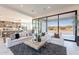 Open concept living room with a large window to the outdoor scenery at 25564 N 119Th St, Scottsdale, AZ 85255