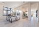Bright home office with large windows, sleek desk, and stylish decor at 25564 N 119Th St, Scottsdale, AZ 85255