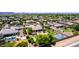 Expansive property with pool, outdoor kitchen, putting green, basketball court, mature landscaping, and mountain views at 2892 E Fruitvale Ave, Gilbert, AZ 85297