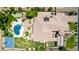 Aerial view of expansive property featuring pool, putting green, basketball court, and private casita at 2892 E Fruitvale Ave, Gilbert, AZ 85297