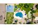 A sprawling backyard with a pool, basketball court, putting green and trampoline offers multiple entertainment options at 2892 E Fruitvale Ave, Gilbert, AZ 85297