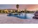 Backyard pool with a spa and a rock waterfall feature at 2892 E Fruitvale Ave, Gilbert, AZ 85297