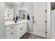 Stylish bathroom features white cabinetry, quartz counters, and modern black fixtures at 2892 E Fruitvale Ave, Gilbert, AZ 85297
