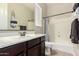 Bathroom with vanity, mirror, and a shower-tub combination at 2892 E Fruitvale Ave, Gilbert, AZ 85297