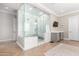 Luxurious bathroom boasting a glass-enclosed shower, marble accents, and ample counter space at 2892 E Fruitvale Ave, Gilbert, AZ 85297
