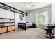 Relaxing bedroom with custom shelving, neutral color palette, and bright natural light at 2892 E Fruitvale Ave, Gilbert, AZ 85297