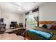 Spacious bedroom with a ceiling fan, curtains, desk, and a cozy area rug at 2892 E Fruitvale Ave, Gilbert, AZ 85297
