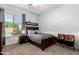 Cozy bedroom with natural light, features a ceiling fan and unique decor accents at 2892 E Fruitvale Ave, Gilbert, AZ 85297