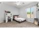 Serene bedroom featuring a vanity table, gray bed frame, and natural light from the window at 2892 E Fruitvale Ave, Gilbert, AZ 85297