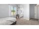 Cozy bedroom with a view into the bathroom and featuring neutral tones and ample natural light at 2892 E Fruitvale Ave, Gilbert, AZ 85297