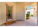 Inviting entrance shows covered porch with stone pavers and well-manicured landscaping at 2892 E Fruitvale Ave, Gilbert, AZ 85297