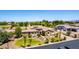 An impressive stone facade home with a well-manicured lawn and desert landscaping creates great curb appeal at 2892 E Fruitvale Ave, Gilbert, AZ 85297