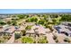 An elevated perspective reveals a luxurious home with a pool, outdoor basketball court, and lush landscaping at 2892 E Fruitvale Ave, Gilbert, AZ 85297