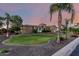 Beautiful stone home boasts a circular turret, expansive front lawn, and manicured landscaping at 2892 E Fruitvale Ave, Gilbert, AZ 85297