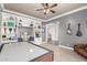 Game room featuring custom built-ins, an air hockey table, and access to multiple rooms at 2892 E Fruitvale Ave, Gilbert, AZ 85297