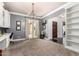 Spacious home office featuring a built-in desk, French doors to the yard, and natural light at 2892 E Fruitvale Ave, Gilbert, AZ 85297