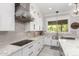 Modern kitchen featuring white cabinets, stainless steel appliances, granite countertops, and backsplash at 2892 E Fruitvale Ave, Gilbert, AZ 85297