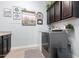 Well-organized laundry room features modern washer/dryer, cabinetry, and stylish decor at 2892 E Fruitvale Ave, Gilbert, AZ 85297