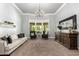 Cozy living room with a large window, comfortable sofa, and elegant furnishings creating a warm atmosphere at 2892 E Fruitvale Ave, Gilbert, AZ 85297