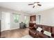 Cozy living room with hardwood floors, wet bar, and comfortable leather sofa at 2892 E Fruitvale Ave, Gilbert, AZ 85297