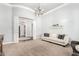 Bright living room featuring neutral carpet, chandelier, and an archway leading to another room at 2892 E Fruitvale Ave, Gilbert, AZ 85297