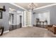 Spacious living room featuring wood floors, and arched hallways at 2892 E Fruitvale Ave, Gilbert, AZ 85297