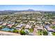 Residential neighborhood with diverse home styles, mature landscaping, and mountain views in the distance at 2892 E Fruitvale Ave, Gilbert, AZ 85297