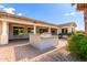 Outdoor kitchen with stone accents, a built-in grill, and a covered patio in a private backyard at 2892 E Fruitvale Ave, Gilbert, AZ 85297