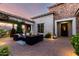 Charming outdoor patio with brick pavers, comfortable seating, and lush greenery enhancing the inviting space at 2892 E Fruitvale Ave, Gilbert, AZ 85297