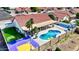 Aerial shot showcases basketball court, swimming pool and desert landscaping at 2940 E Norwood St, Mesa, AZ 85213
