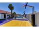 Backyard basketball court, pool, and outdoor living spaces create a fun and functional recreational area at 2940 E Norwood St, Mesa, AZ 85213