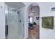 Modern shower and access to stylish bedroom showcasing a four-poster bed and calming atmosphere at 2940 E Norwood St, Mesa, AZ 85213