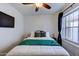 Comfortable bedroom featuring a window, modern decor, and a relaxing ambiance at 2940 E Norwood St, Mesa, AZ 85213