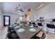 Spacious dining room features seating for ten, near an eat-in kitchen and unique mural at 2940 E Norwood St, Mesa, AZ 85213