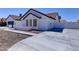 Charming single-story home showcasing desert landscaping, concrete driveway and neutral exterior paint at 2940 E Norwood St, Mesa, AZ 85213