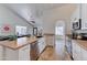 The kitchen features a breakfast bar and stainless steel appliances, with dining area access at 2940 E Norwood St, Mesa, AZ 85213