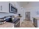 Bright kitchen featuring stainless steel appliances, white cabinets, and plenty of counter space at 2940 E Norwood St, Mesa, AZ 85213