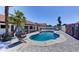 The backyard offers a pool, lounge area, unique mural, and ample space for relaxation and entertainment at 2940 E Norwood St, Mesa, AZ 85213