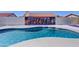 Sparkling swimming pool with Arizona mural and desert landscaping at 2940 E Norwood St, Mesa, AZ 85213