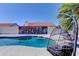 Stunning backyard with pool, custom mural, and unique hanging chair at 2940 E Norwood St, Mesa, AZ 85213