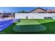 The backyard boasts a putting green and basketball court, perfect for outdoor recreation and fun at 2940 E Norwood St, Mesa, AZ 85213