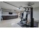 Finished basement featuring a gym area, sofa and mounted television at 3058 E Nance St, Mesa, AZ 85213