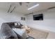Finished basement featuring a sofa, table, and television at 3058 E Nance St, Mesa, AZ 85213