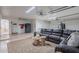 Finished basement featuring a sofa, table and gym area at 3058 E Nance St, Mesa, AZ 85213