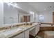 Bathroom features double sinks, granite countertops and a luxurious soaking tub at 3058 E Nance St, Mesa, AZ 85213