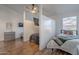 Shared bedroom with ceiling fan, hard wood floors, and a mounted television at 3058 E Nance St, Mesa, AZ 85213