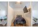 Bedroom features hardwood floors and a mounted television at 3058 E Nance St, Mesa, AZ 85213
