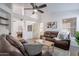Open-concept living room features hardwood floors, modern décor, natural light, and comfortable seating at 3058 E Nance St, Mesa, AZ 85213