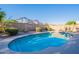 Sparkling pool with diving board, surrounded by a concrete deck and privacy wall at 3058 E Nance St, Mesa, AZ 85213